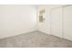 Bright bedroom featuring a window and a closet with sliding doors at 2668 E San Miguel Dr, Casa Grande, AZ 85194
