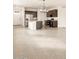 Modern kitchen with stainless steel appliances, granite counters, and tile flooring at 2668 E San Miguel Dr, Casa Grande, AZ 85194