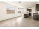Open-concept kitchen and living area with natural light and modern tile flooring at 2668 E San Miguel Dr, Casa Grande, AZ 85194