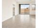 Spacious living room with sliding glass doors that lead to the backyard and patio at 2668 E San Miguel Dr, Casa Grande, AZ 85194