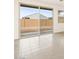 Bright living room with tile floors and a large sliding glass door at 2668 E San Miguel Dr, Casa Grande, AZ 85194