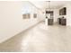 Open-concept living space featuring tile flooring, bright windows, and a modern kitchen at 2668 E San Miguel Dr, Casa Grande, AZ 85194