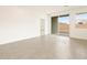 Spacious living area with tile flooring, sliding glass doors and view of fenced yard at 2668 E San Miguel Dr, Casa Grande, AZ 85194