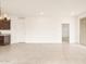 Open-concept living space with tile flooring, bright windows, and modern chandelier at 2668 E San Miguel Dr, Casa Grande, AZ 85194