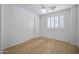 Bedroom with wood floors, a ceiling fan and a bright window at 2831 W Margy Ct, Phoenix, AZ 85017