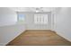 Bright bedroom featuring hardwood floors, a ceiling fan, and shuttered windows at 2831 W Margy Ct, Phoenix, AZ 85017
