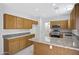 Kitchen features stainless steel appliances, granite countertops, tile floors and wooden cabinets at 2831 W Margy Ct, Phoenix, AZ 85017