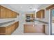 Well lit kitchen with stainless steel appliances, tile floors, and granite countertops at 2831 W Margy Ct, Phoenix, AZ 85017