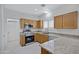 Well lit kitchen features tile floors, stainless steel appliances, and granite countertops at 2831 W Margy Ct, Phoenix, AZ 85017