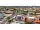 Home with solar panels and a pool, nestled in a vibrant residential neighborhood at 3001 E Winchcomb Dr, Phoenix, AZ 85032
