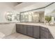 Stylish bathroom featuring modern fixtures, stone countertops, and lots of storage at 3001 E Winchcomb Dr, Phoenix, AZ 85032