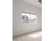 Bright bedroom with a large window offering a view of the neighborhood at 3001 E Winchcomb Dr, Phoenix, AZ 85032