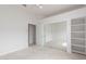Spacious bedroom featuring mirrored closet doors and built-in shelving at 3001 E Winchcomb Dr, Phoenix, AZ 85032
