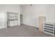 Bonus room with a wet bar, filing cabinets, and built-in shelving at 3001 E Winchcomb Dr, Phoenix, AZ 85032