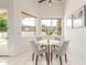 Bright breakfast nook with views, a modern table and four chairs create a perfect space for casual dining at 3001 E Winchcomb Dr, Phoenix, AZ 85032