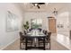 Elegant dining room with a modern table, stylish chairs, and sophisticated decor at 3001 E Winchcomb Dr, Phoenix, AZ 85032