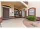 Cozy front porch with desert landscaping and an inviting seating area at 3001 E Winchcomb Dr, Phoenix, AZ 85032
