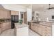 Spacious kitchen with a center island, black appliances, and ample cabinet space at 3001 E Winchcomb Dr, Phoenix, AZ 85032
