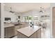 Open-concept kitchen with a center island, modern appliances, and a breakfast nook overlooking the backyard at 3001 E Winchcomb Dr, Phoenix, AZ 85032