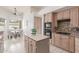 Well-appointed kitchen with stainless steel appliances, a center island, and a cozy breakfast nook at 3001 E Winchcomb Dr, Phoenix, AZ 85032