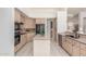 Spacious kitchen with ample cabinet space, stainless steel appliances, and a functional center island at 3001 E Winchcomb Dr, Phoenix, AZ 85032