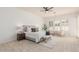 Serene main bedroom with lots of natural light, plush carpet, and a seating area at 3001 E Winchcomb Dr, Phoenix, AZ 85032