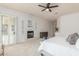 Spacious main bedroom with fireplace and a decorative ceiling fan, creating a cozy retreat at 3001 E Winchcomb Dr, Phoenix, AZ 85032