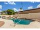 Sparkling pool featuring rock accents and a refreshing escape from the Arizona heat at 3001 E Winchcomb Dr, Phoenix, AZ 85032
