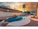 Back yard featuring desert landscaping and a free form pool with rock waterfall feature, and mountain views at 3001 E Winchcomb Dr, Phoenix, AZ 85032