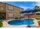 Beautiful backyard pool surrounded by desert landscaping and a privacy fence at 30013 N Candlewood Dr, San Tan Valley, AZ 85143