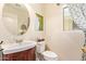 Vanity and toilet with a decorative curtain next to the window at 30013 N Candlewood Dr, San Tan Valley, AZ 85143