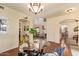 Bright dining area featuring hardwood floors and a view of the open-concept home at 30013 N Candlewood Dr, San Tan Valley, AZ 85143