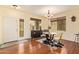 Bright dining room with hardwood floors and stylish chandelier fixture at 30013 N Candlewood Dr, San Tan Valley, AZ 85143