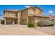 Attractive home with three-car garage, desert landscaping, and a spacious driveway at 30013 N Candlewood Dr, San Tan Valley, AZ 85143