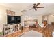 Open living space with wood floors, staircase, and ceiling fan at 30013 N Candlewood Dr, San Tan Valley, AZ 85143