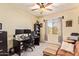 Office has neutral decor with ceiling fan at 30013 N Candlewood Dr, San Tan Valley, AZ 85143