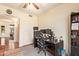 Home office setup with desk, multiple monitors, and rolling chair at 30013 N Candlewood Dr, San Tan Valley, AZ 85143