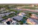 Expansive aerial view of a suburban neighborhood with a private pool and modern home design at 3145 E Boot Track Trl, Gilbert, AZ 85296