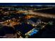 Aerial view of a home showcasing its backyard pool, patio and neighborhood at 3145 E Boot Track Trl, Gilbert, AZ 85296