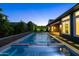 Captivating outdoor oasis featuring a modern pool, tasteful landscaping, and refined architectural details at 3145 E Boot Track Trl, Gilbert, AZ 85296