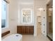 Luxurious bathroom with a soaking tub, dual vanities, and an illuminated mirror at 3145 E Boot Track Trl, Gilbert, AZ 85296