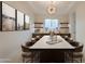 Elegant dining room with modern chandelier and display shelves, great for entertaining at 3145 E Boot Track Trl, Gilbert, AZ 85296