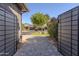 Gated entrance unveils a paver driveway and an attractive home exterior at 3145 E Boot Track Trl, Gilbert, AZ 85296