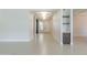 Bright entryway with clean lines, showcasing a custom cabinet with display shelves and natural light at 3145 E Boot Track Trl, Gilbert, AZ 85296