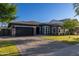Charming single-story home features a well-manicured front yard, brick-paved driveway, and attached garage at 3145 E Boot Track Trl, Gilbert, AZ 85296