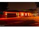 Charming home exterior with red holiday lights and a brick driveway, great curb appeal at 3145 E Boot Track Trl, Gilbert, AZ 85296