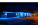Beautiful home exterior with blue holiday lights and brick driveway, providing curb appeal at 3145 E Boot Track Trl, Gilbert, AZ 85296