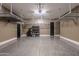 Garage featuring painted walls, shiny epoxy floor and ceiling mounted storage racks at 3145 E Boot Track Trl, Gilbert, AZ 85296