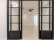 Hallway with view into the bedroom, accentuated by modern sliding doors and an open, airy design at 3145 E Boot Track Trl, Gilbert, AZ 85296