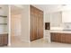 Modern kitchen featuring custom wood cabinets, a spacious island, and ample storage at 3145 E Boot Track Trl, Gilbert, AZ 85296